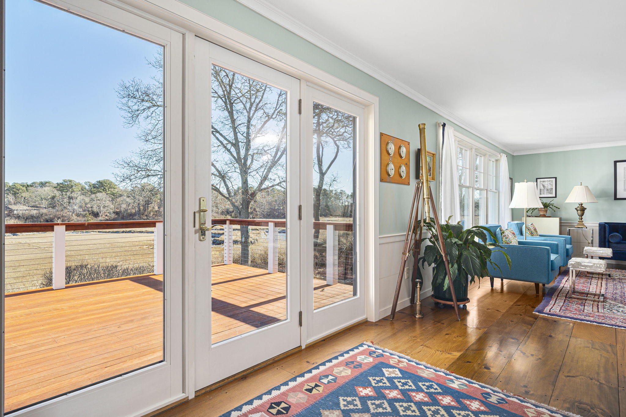 46 Lookout Road Yarmouth Port, MA 02675 - Photo 13 of 49 a living room with furniture floor to ceiling window and wooden floor