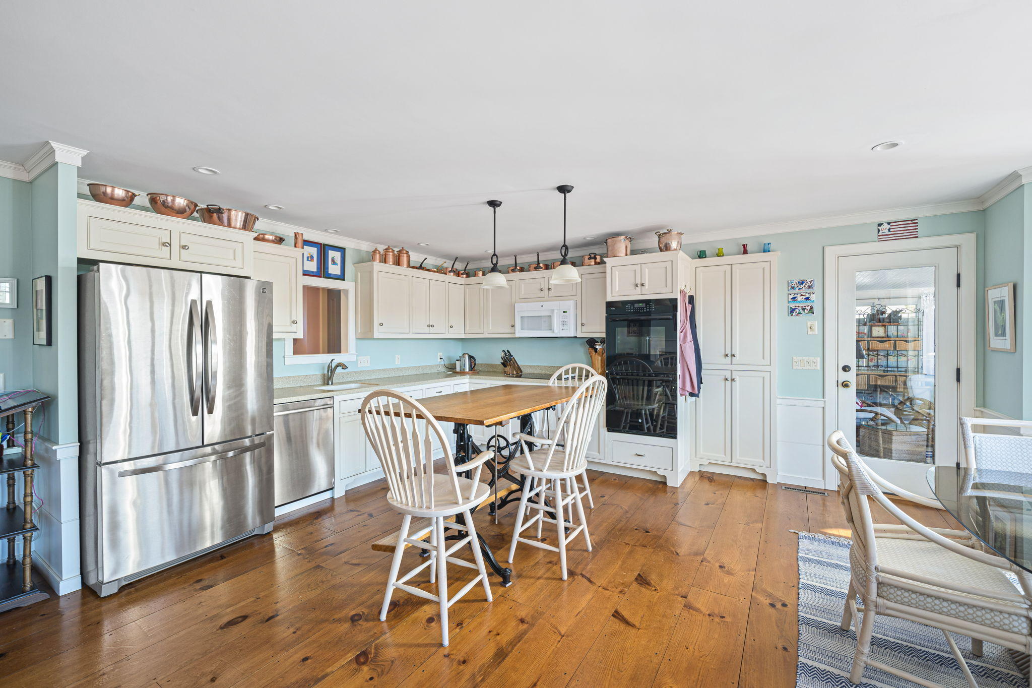 46 Lookout Road Yarmouth Port, MA 02675 - Photo 7 of 49 a kitchen with stainless steel appliances a dining table chairs refrigerator and sink