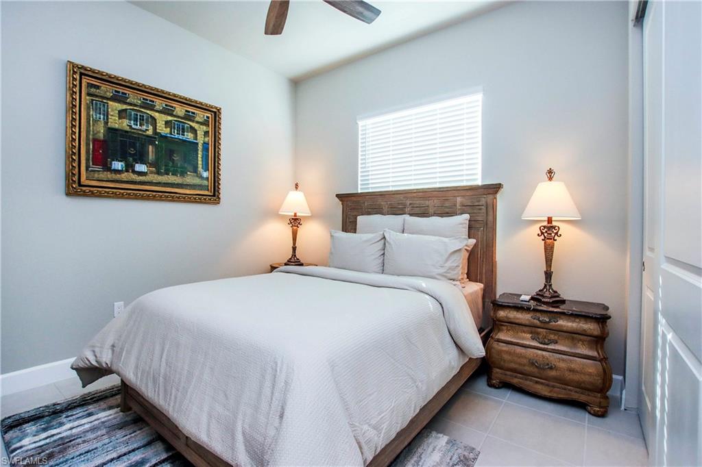 11857 Hydrangea Place Naples, FL 34120 - Photo 24 of 50 a bedroom with bed and a window