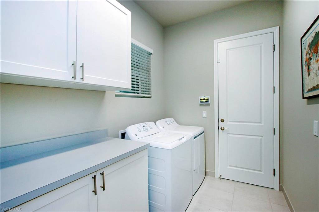 11857 Hydrangea Place Naples, FL 34120 - Photo 30 of 50 a room with a sink cabinets and utility