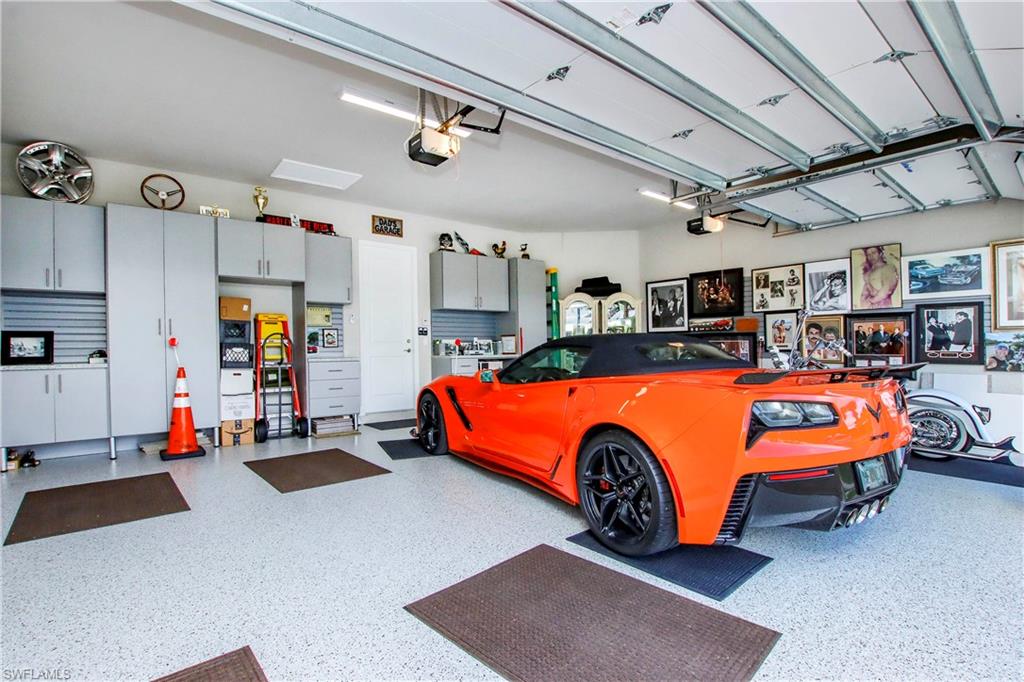 11857 Hydrangea Place Naples, FL 34120 - Photo 42 of 50 a blue bed sitting in a room next to a larger window