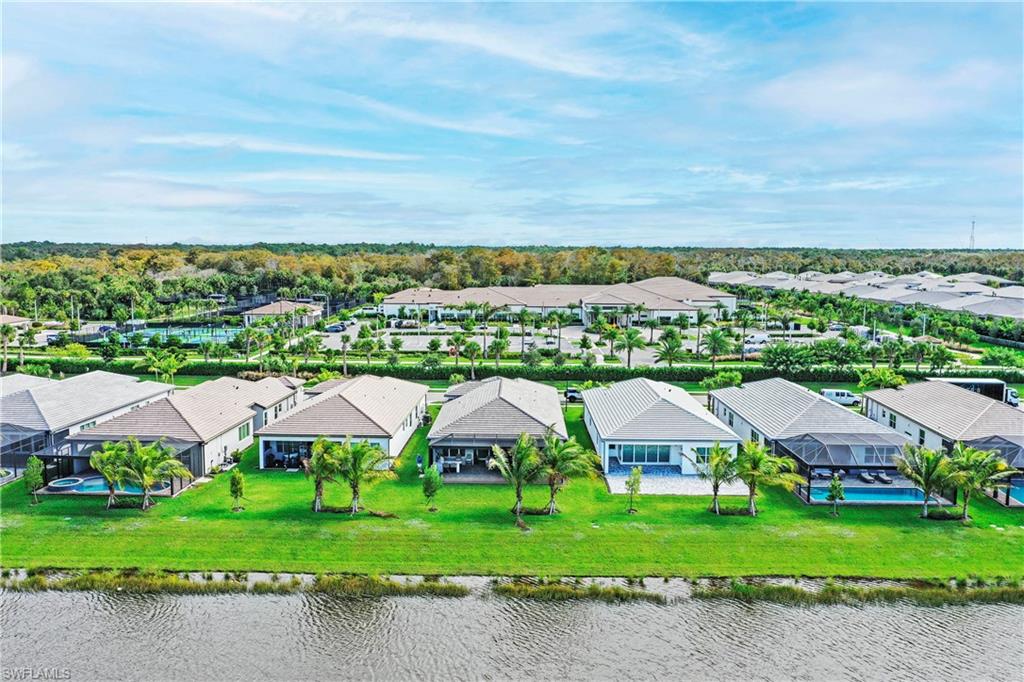 11857 Hydrangea Place Naples, FL 34120 - Photo 47 of 50 a view of a big yard next to a big yard