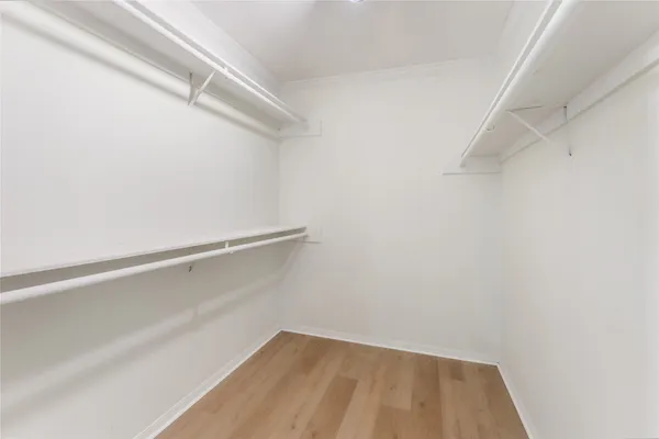 a view of an empty walk in closet