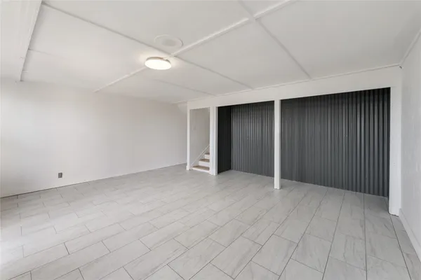 an empty room with white walls