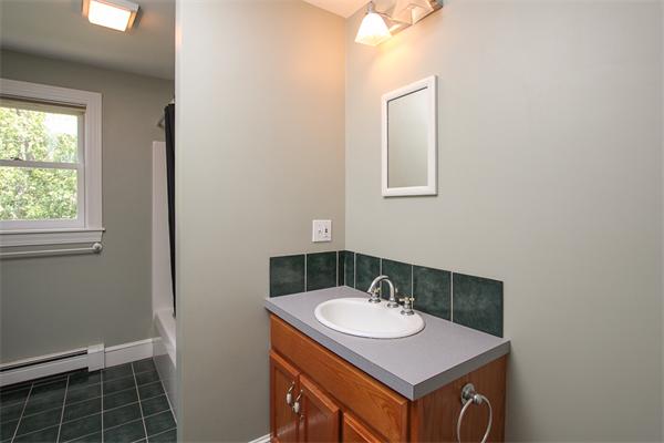 17 Old Rubbly Road Beverly, MA 01915 - Photo 12 of 17 a bathroom with a sink and a mirror