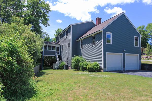 17 Old Rubbly Road Beverly, MA 01915 - Photo 17 of 17 a front view of a house with garden