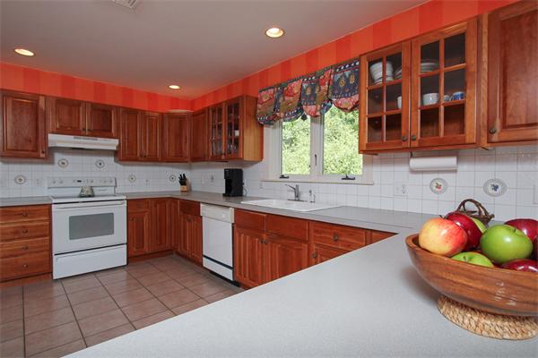 17 Old Rubbly Road Beverly, MA 01915 - Photo 5 of 17 a kitchen with stainless steel appliances granite countertop a sink a stove and cabinets
