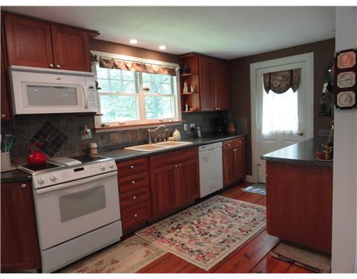 52 Montauk Road Charlestown, RI 02813 - Photo 3 of 16 Kitchen. Nice size working kitchen is open to the great room. There is also a large pantry next to the refrigerator and door leading to one end of the wrap-around deck.