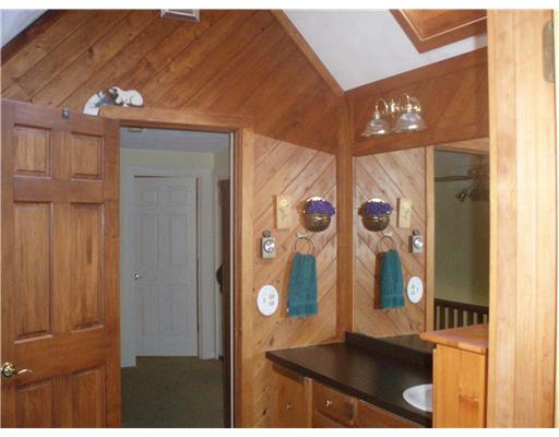 52 Montauk Road Charlestown, RI 02813 - Photo 6 of 16 Bathroom. The upstairs bathroom has lots of warm tones and a great skylite.