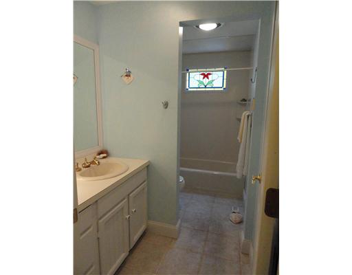 52 Montauk Road Charlestown, RI 02813 - Photo 8 of 16 Bathroom. Eye-catching stained glass window in the main bathroom.
