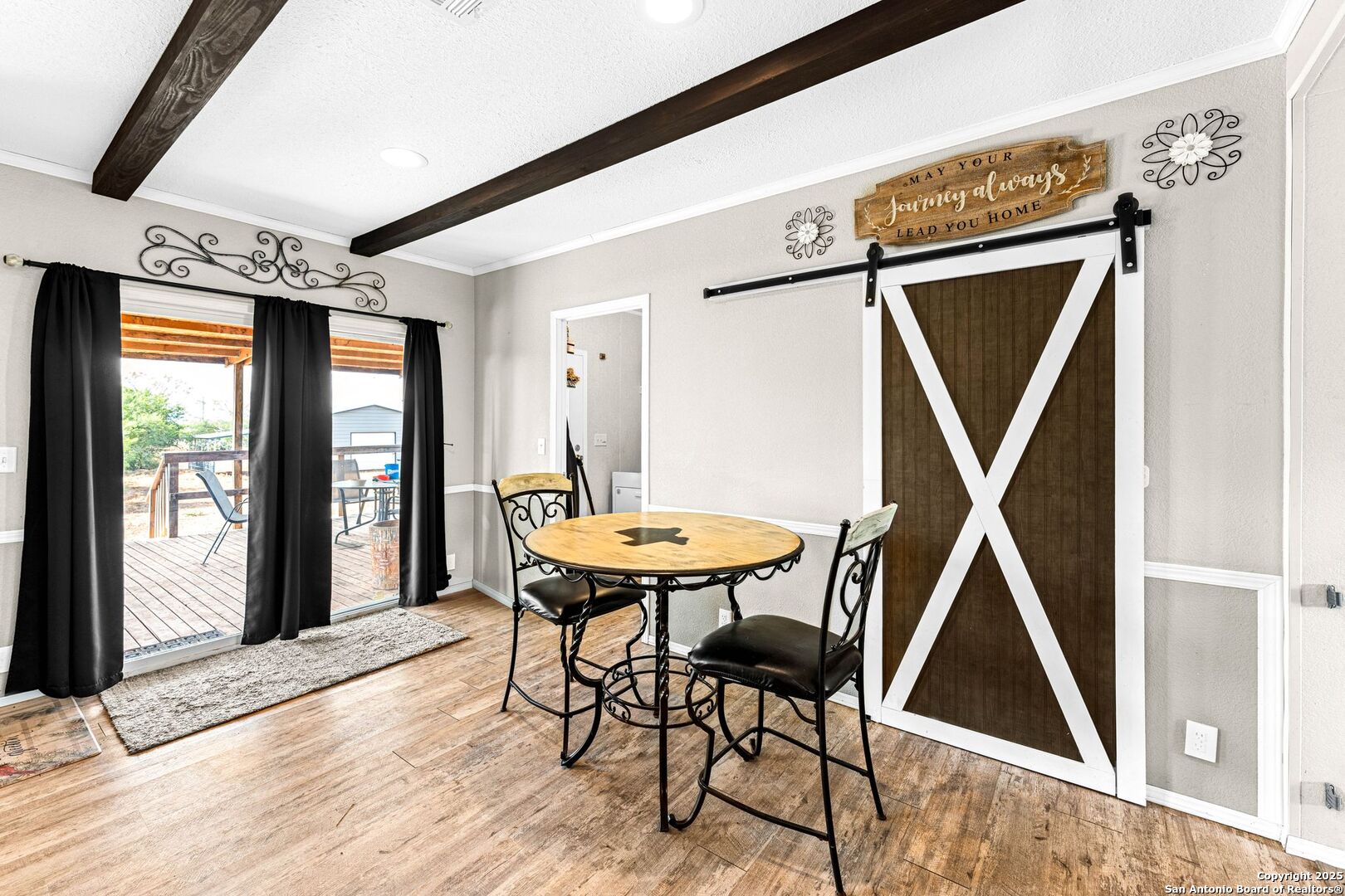 1979 County Road 651 Devine, TX 78016 - Photo 14 of 52 a view of a dining room with furniture and window