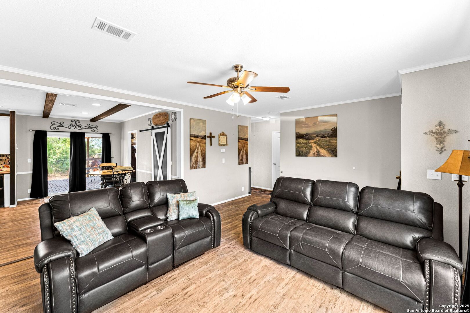 1979 County Road 651 Devine, TX 78016 - Photo 7 of 52 a living room with furniture and a large window
