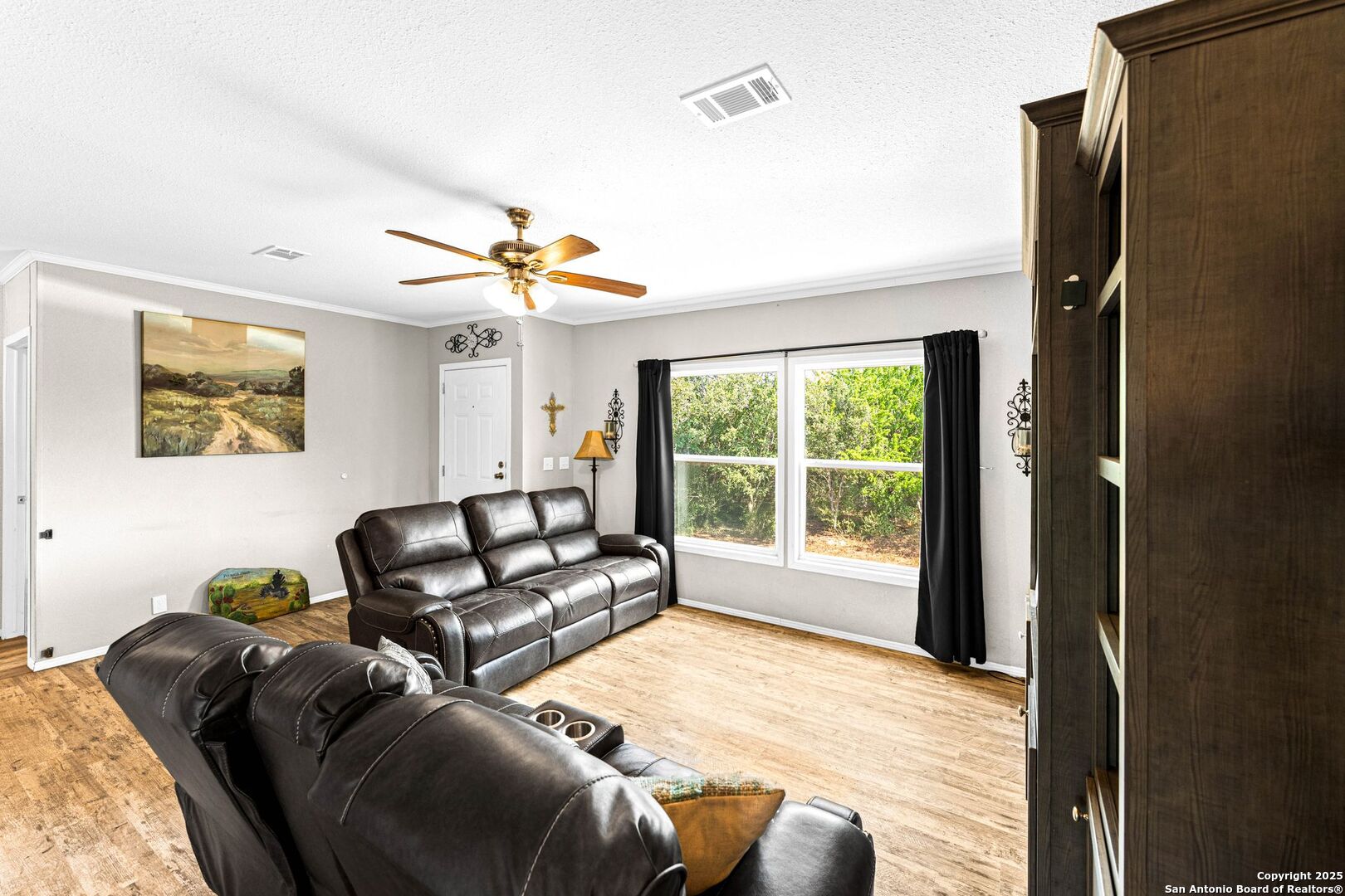 1979 County Road 651 Devine, TX 78016 - Photo 9 of 52 a living room with furniture and a window