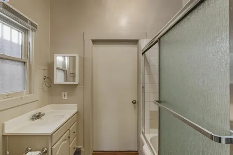 a bathroom with a sink and mirror