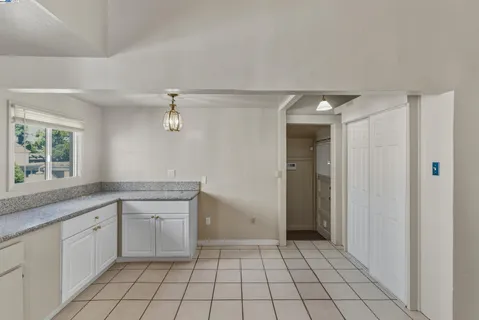 a spacious bathroom with a sink a mirror and a shower