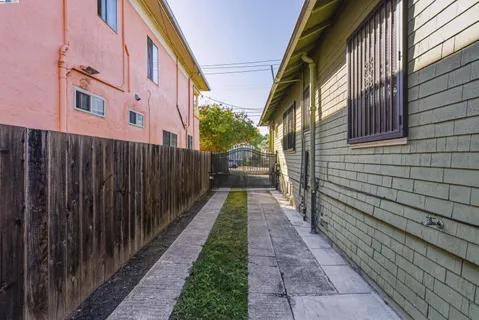 a view of a pathway with a backyard