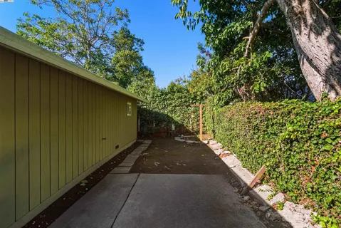a backyard of a house with lots of green space