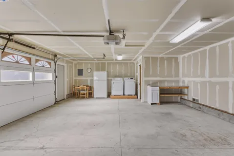 a view of empty room with white walls