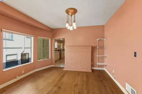 a view of a livingroom with wooden floor