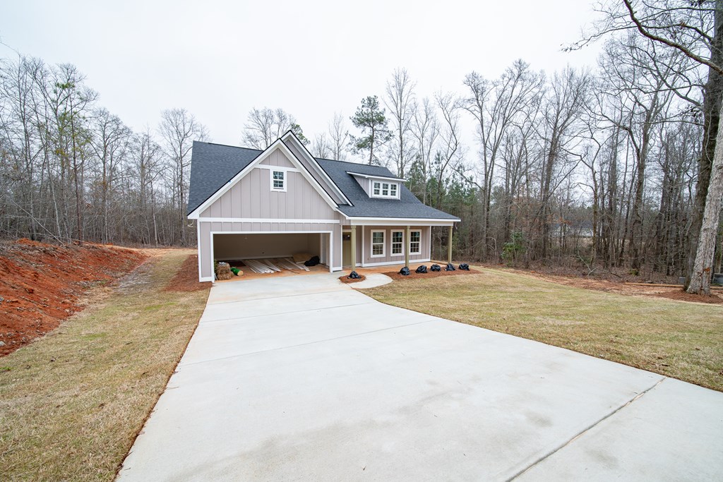181 Twin Lakes Road Waverly Hall, GA 31831 - Photo 2 of 9 a front view of a house with a yard