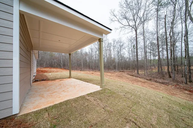 a backyard of a house with a trees