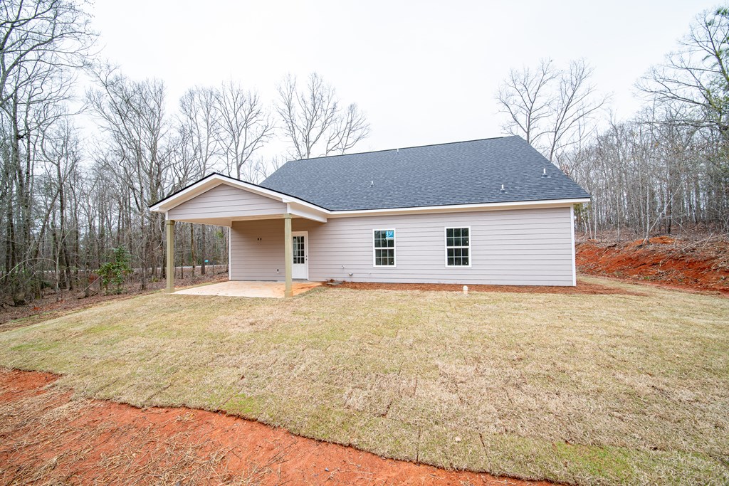 181 Twin Lakes Road Waverly Hall, GA 31831 - Photo 6 of 9 a front view of house with yard and trees around
