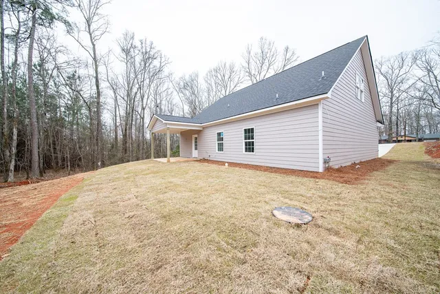 a view of a backyard of the house