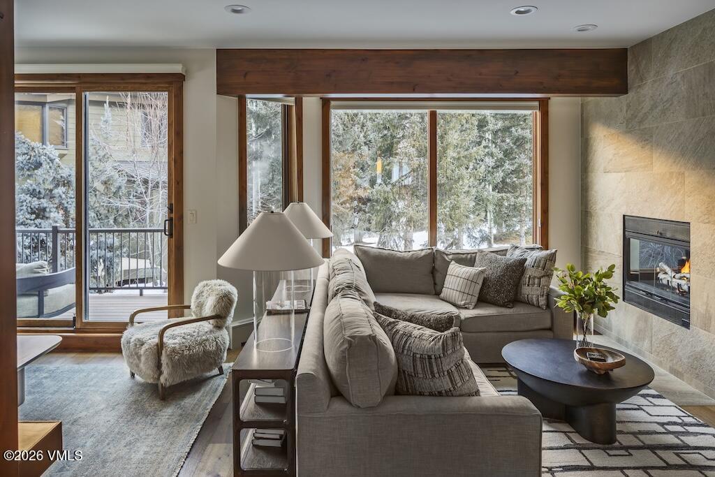 1670 Fall Ridge Road, Unit C11 Vail, CO 81657 - Photo 3 of 39 a living room with furniture and a potted plant