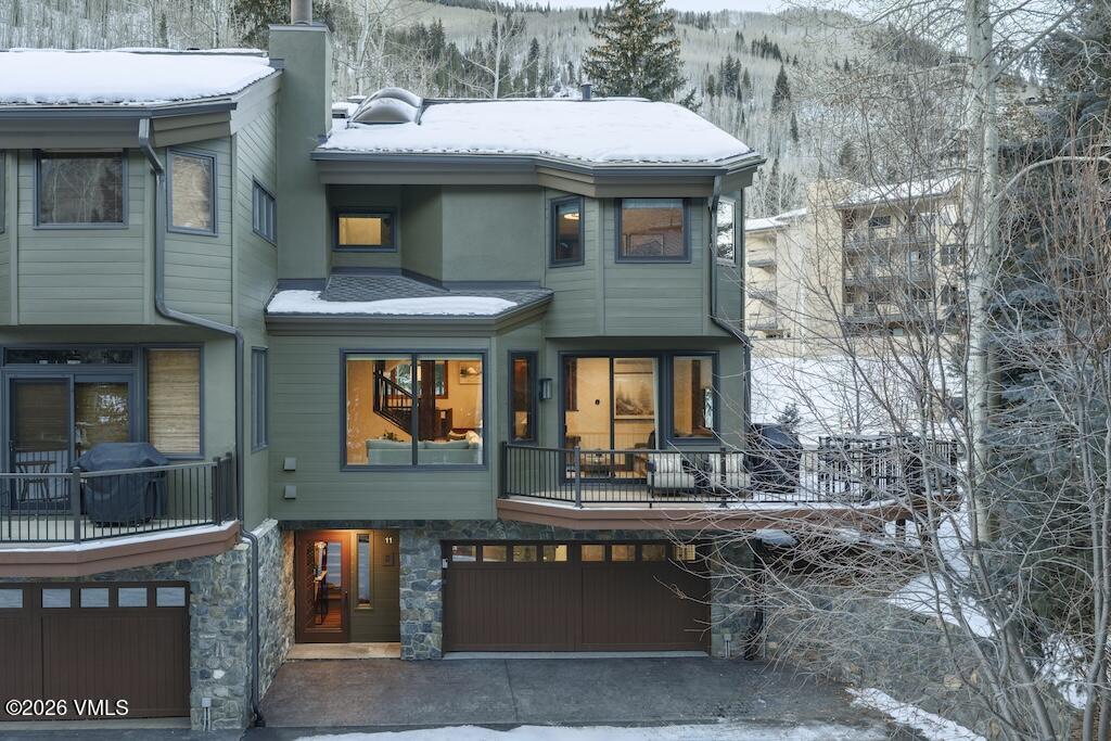 1670 Fall Ridge Road, Unit C11 Vail, CO 81657 - Photo 39 of 39 a front view of a house with a yard