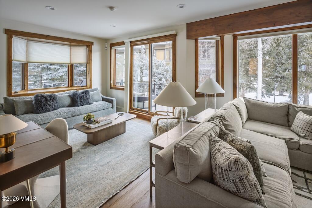 1670 Fall Ridge Road, Unit C11 Vail, CO 81657 - Photo 5 of 39 a living room with furniture and floor to ceiling windows