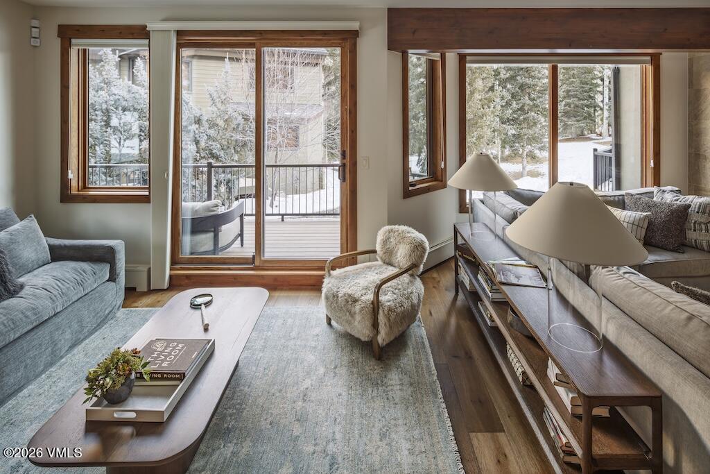1670 Fall Ridge Road, Unit C11 Vail, CO 81657 - Photo 8 of 39 a living room with furniture and a large window