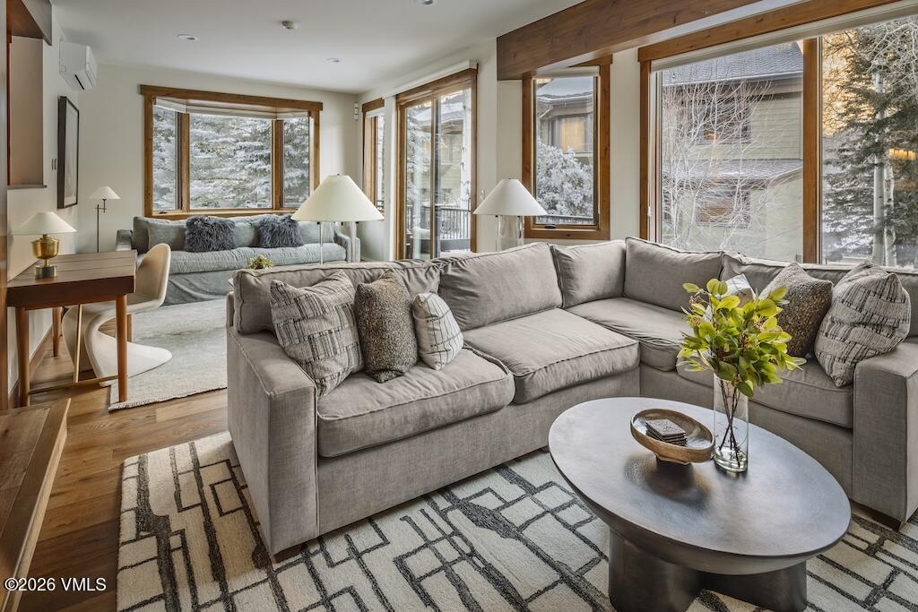 1670 Fall Ridge Road, Unit C11 Vail, CO 81657 - Photo 9 of 39 a living room with furniture and a large window