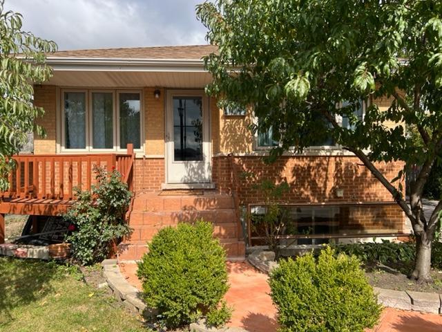 1029 West Irving Park Road Bensenville, IL 60106 - Photo 1 of 14 a front view of a house with a yard
