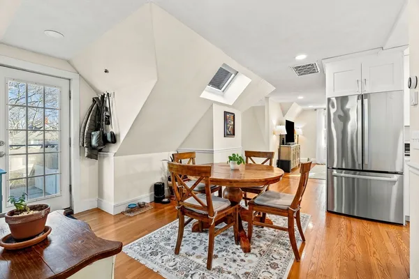 a view of a dining room with furniture window and wooden floor