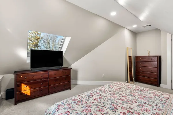 a living room with furniture and flat screen tv
