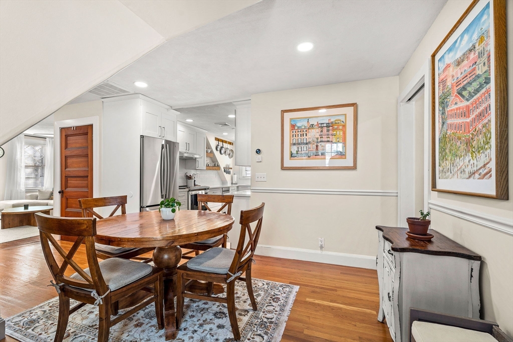 28 Columbus Avenue, Unit 3 Beverly, MA 01915 - Photo 16 of 40 a view of a dining room with furniture and wooden floor