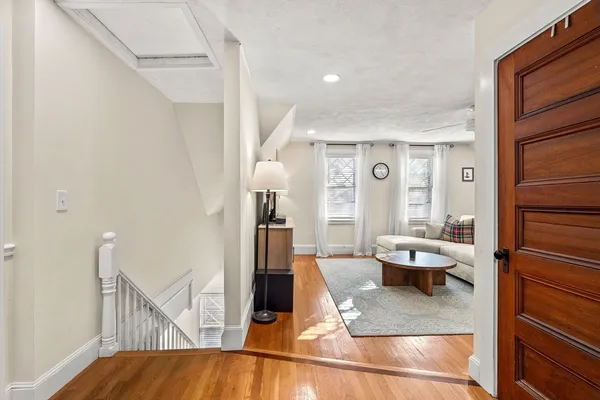 a living room with furniture and a rug