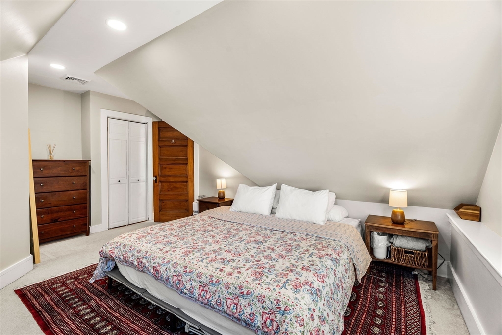 28 Columbus Avenue, Unit 3 Beverly, MA 01915 - Photo 26 of 40 a bedroom with a bed and dresser