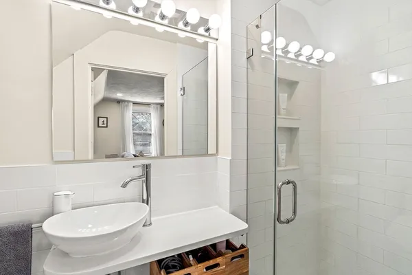 a bathroom with a sink and a mirror
