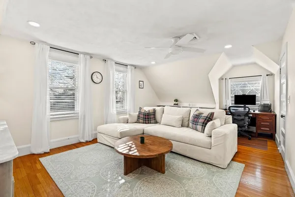 a living room with furniture and a rug