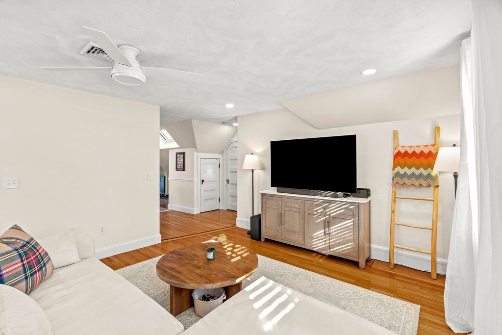 28 Columbus Avenue, Unit 3 Beverly, MA 01915 - Photo 6 of 40 a living room with furniture and a flat screen tv