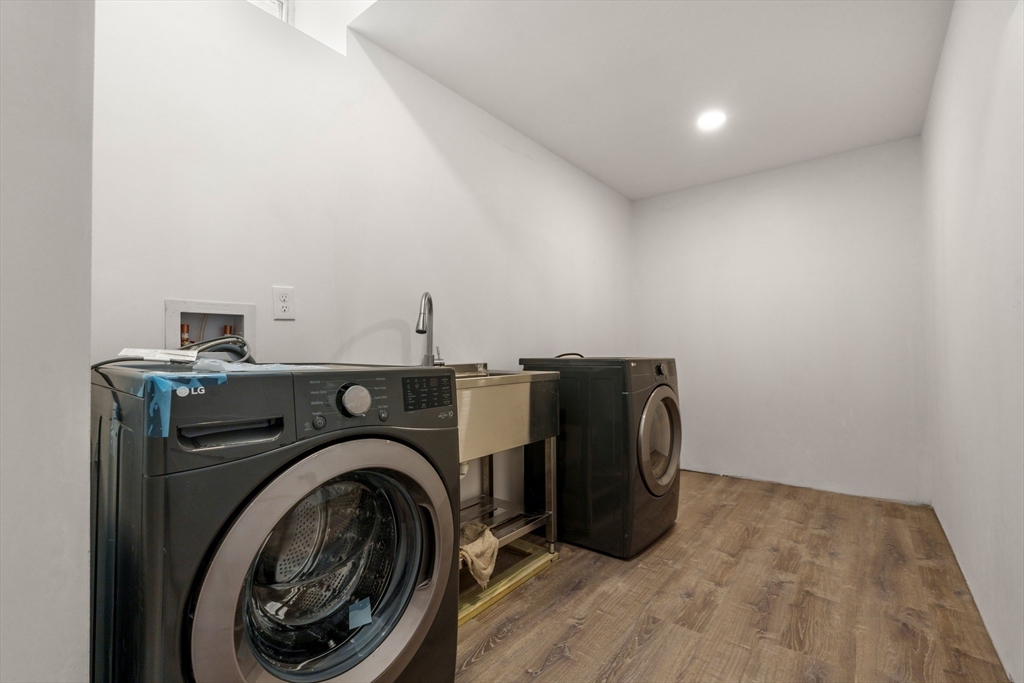 58 Dustin Street, Unit 1 Boston, MA 02135 - Photo 7 of 9 a utility room with dryer and washer