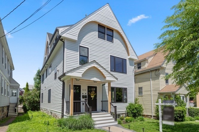58 Dustin Street, Unit 1 Boston, MA 02135 - Photo 9 of 9 a front view of a house with a yard