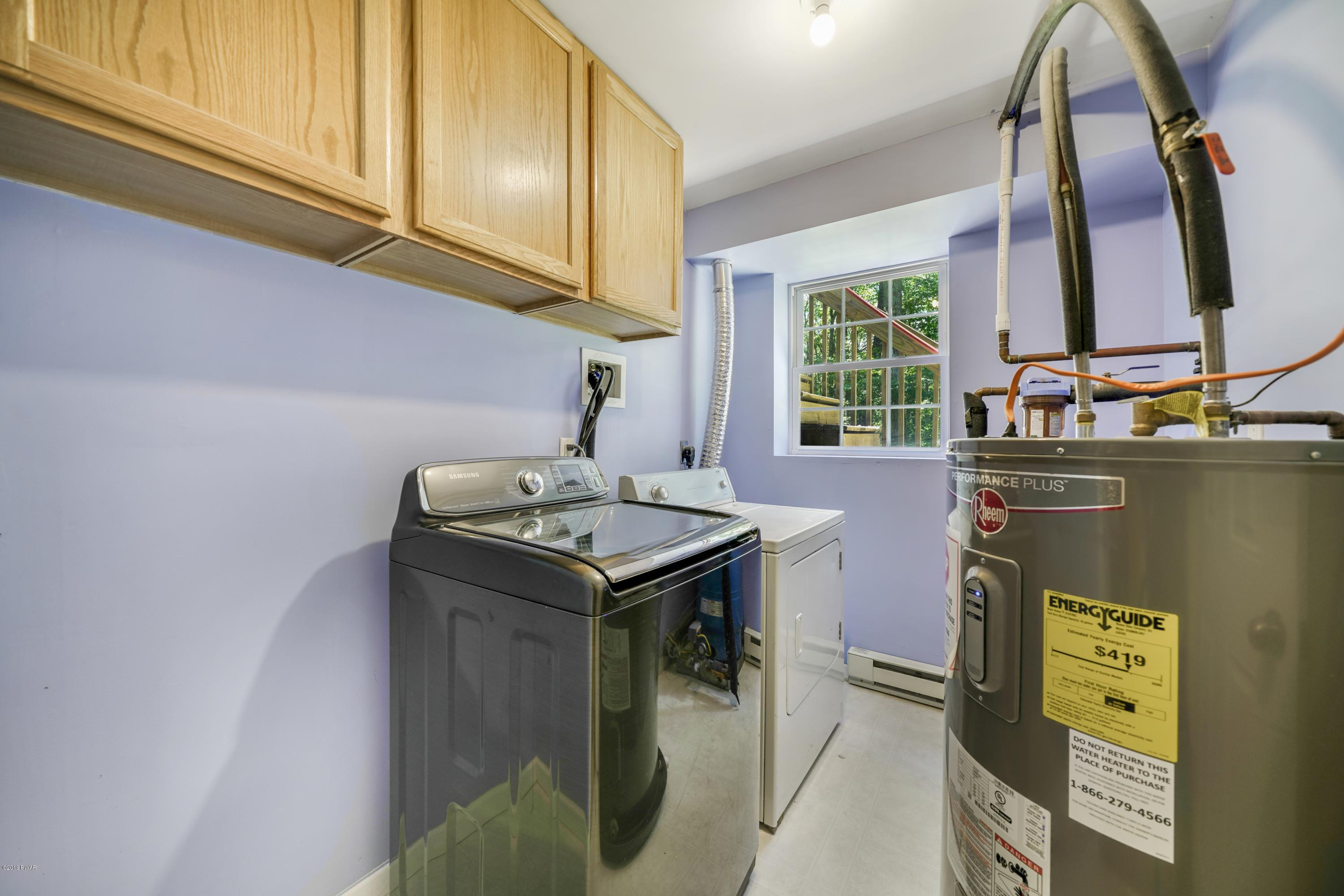 129 Butternut Road Milford, PA 18337 - Photo 24 of 26 a utility room with a sink a washer and dryer