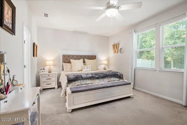 a view of a porch with furniture and a yard