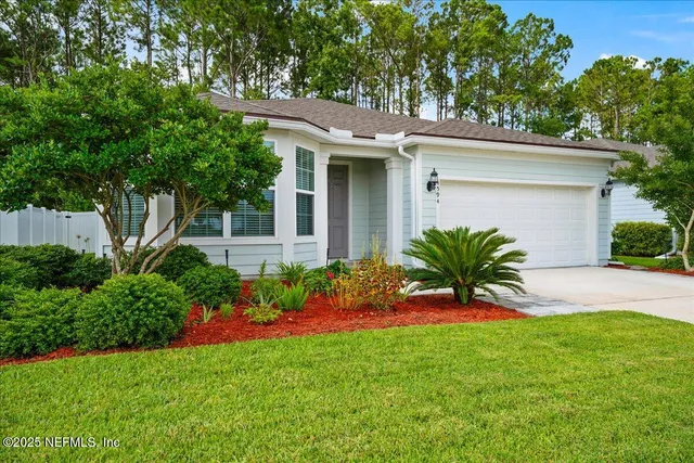 a bathroom with a double vanity sink mirror and toilet