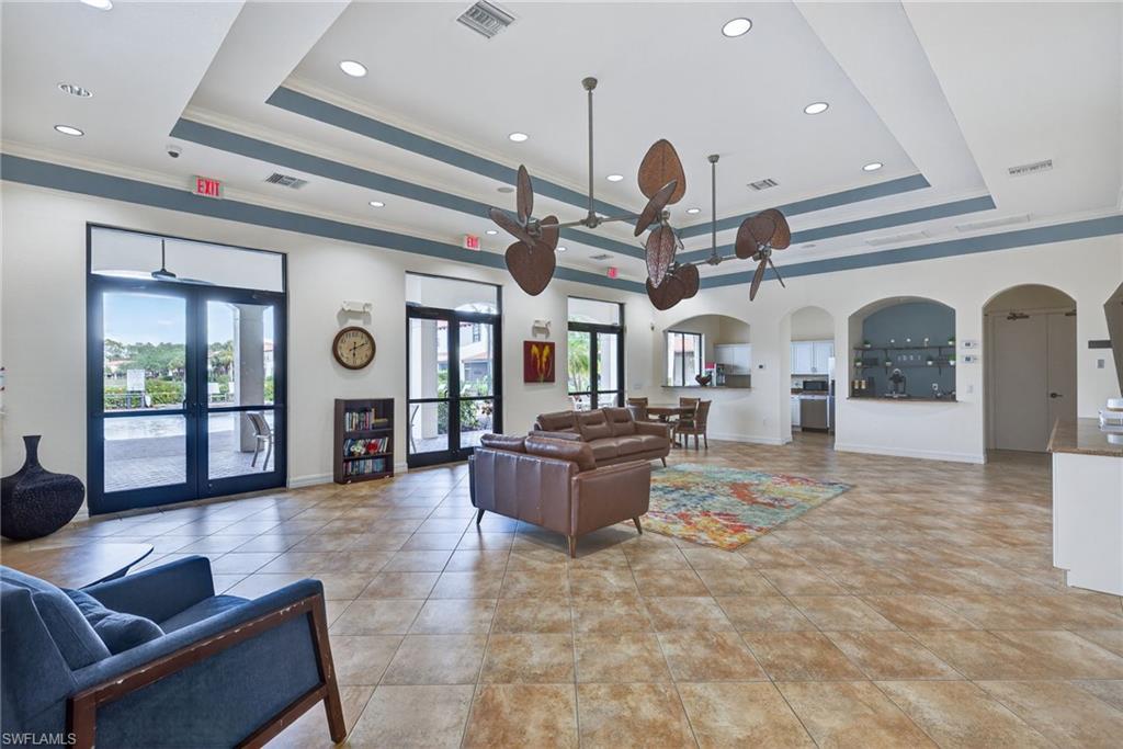 7845 Bristol Circle Naples, FL 34120 - Photo 29 of 31 a living room with furniture and a large window
