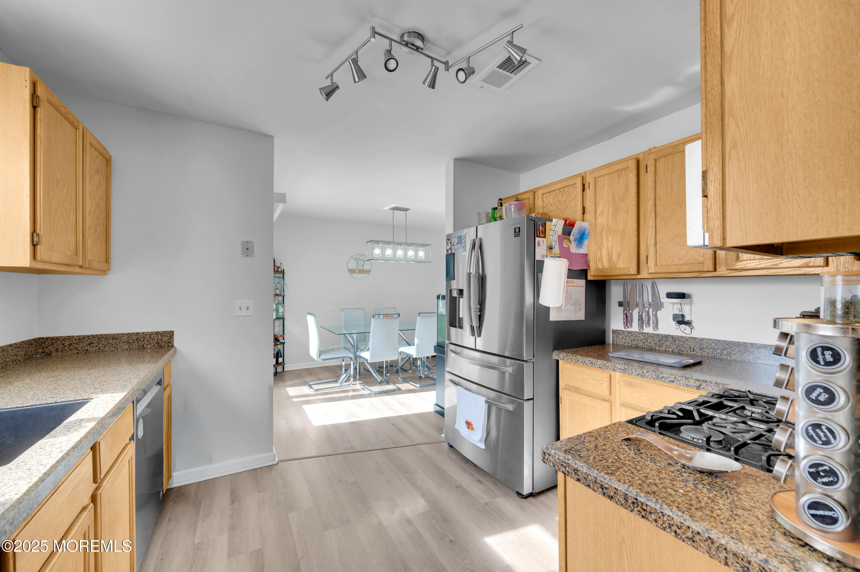 21 Shelli Terrace Barnegat, NJ 08005 - Photo 12 of 42 a kitchen with stainless steel appliances kitchen island granite countertop a stove and a refrigerator