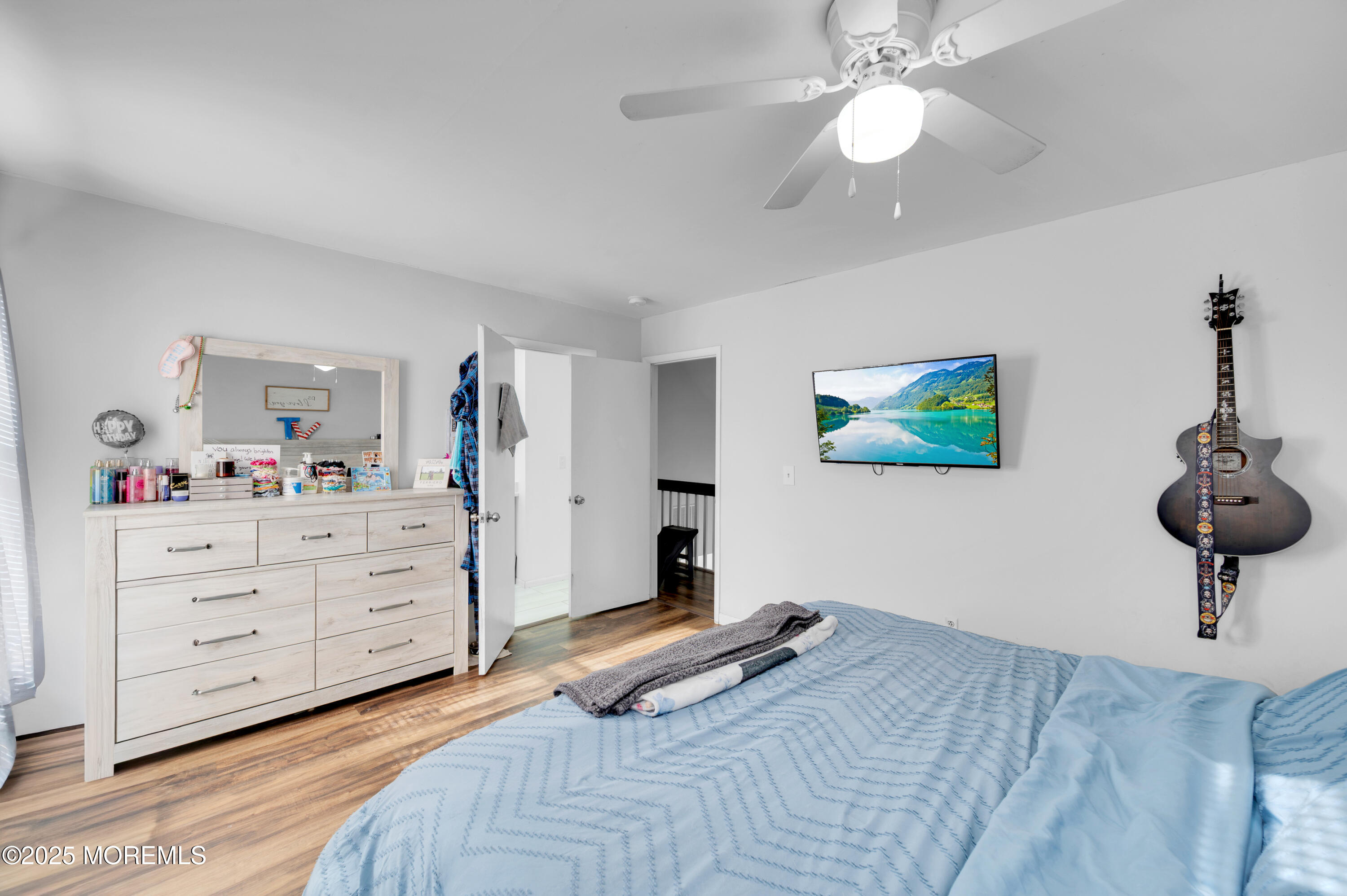 21 Shelli Terrace Barnegat, NJ 08005 - Photo 21 of 42 a bedroom with a bed and a chandelier