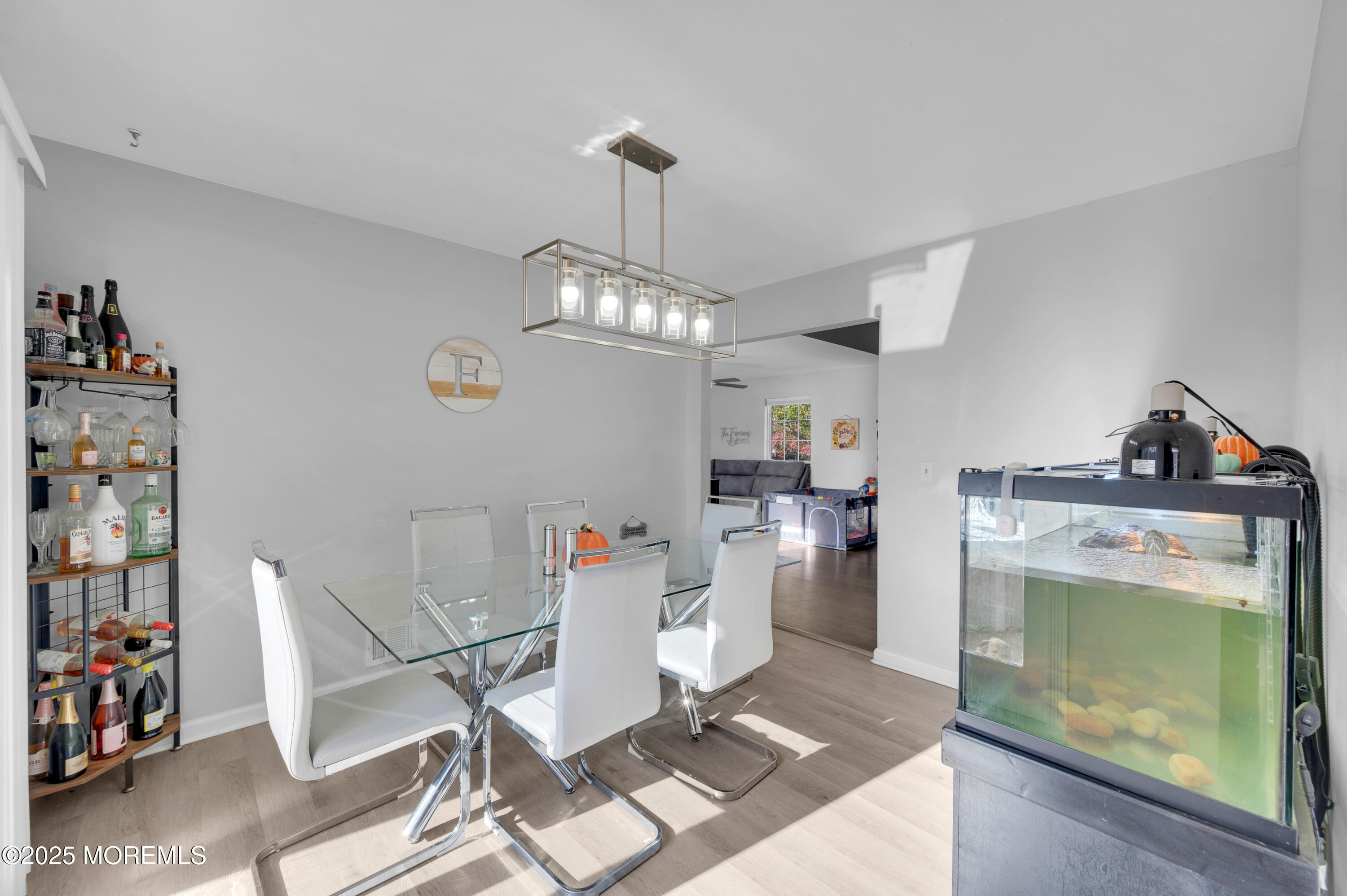 21 Shelli Terrace Barnegat, NJ 08005 - Photo 9 of 42 a living room with a couch and a stove with wooden floor